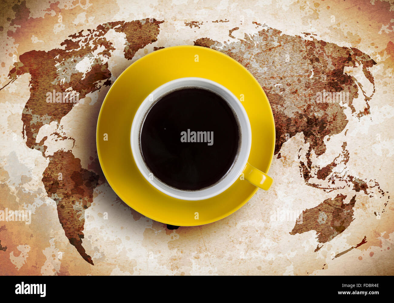 Cup of coffee with world map at background Stock Photo