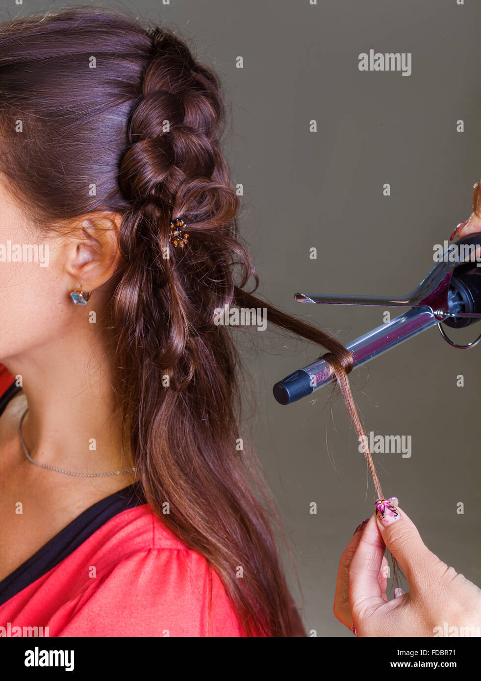 Stylist curling long hair iron hi-res stock photography and images - Alamy