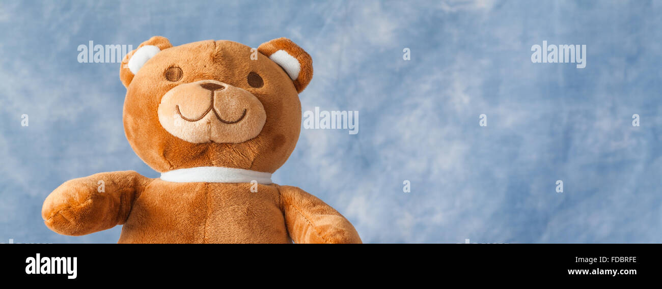 Teddy Bear toy on blue sky background with copyspace Stock Photo - Alamy