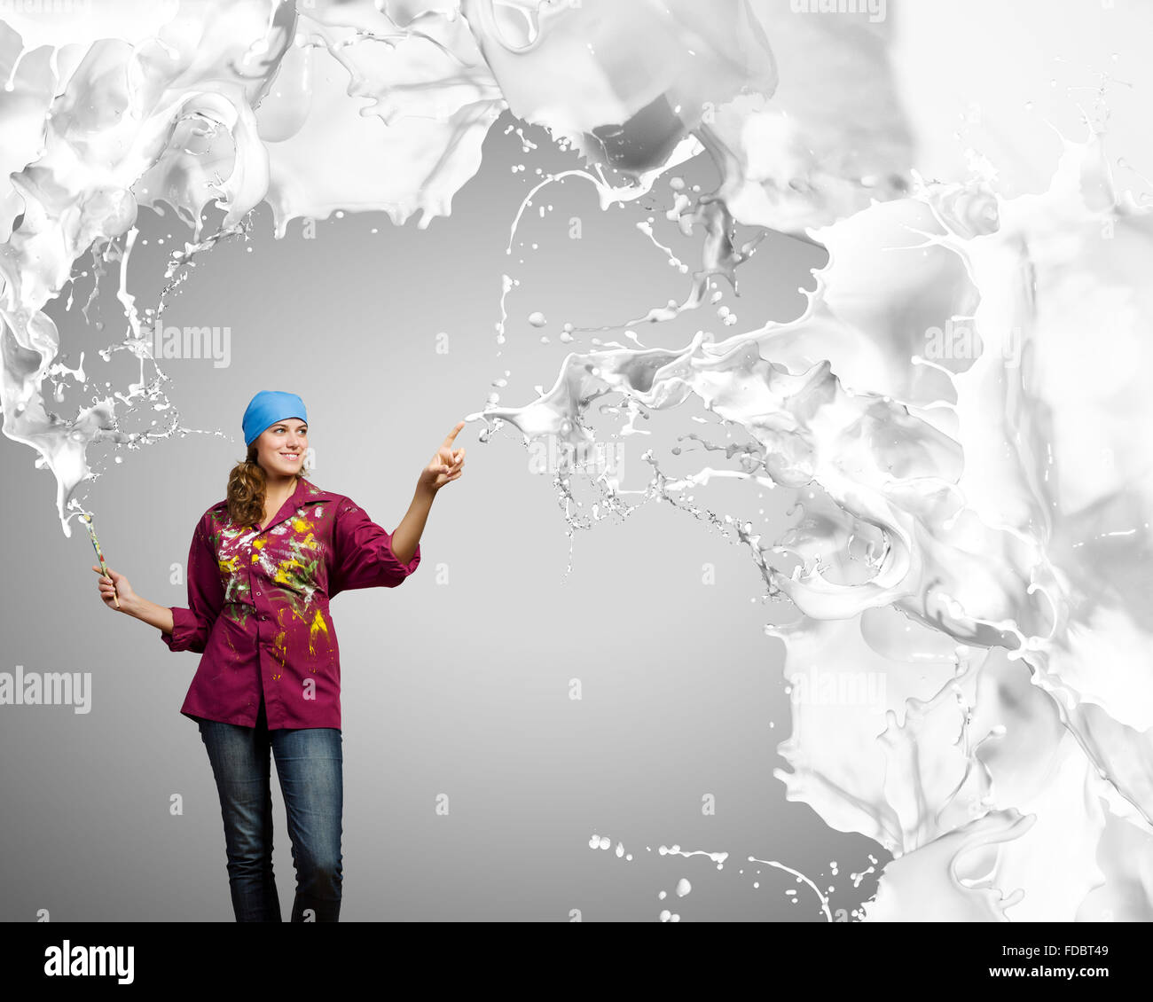 Young woman painter with brush and white splashes above Stock Photo - Alamy