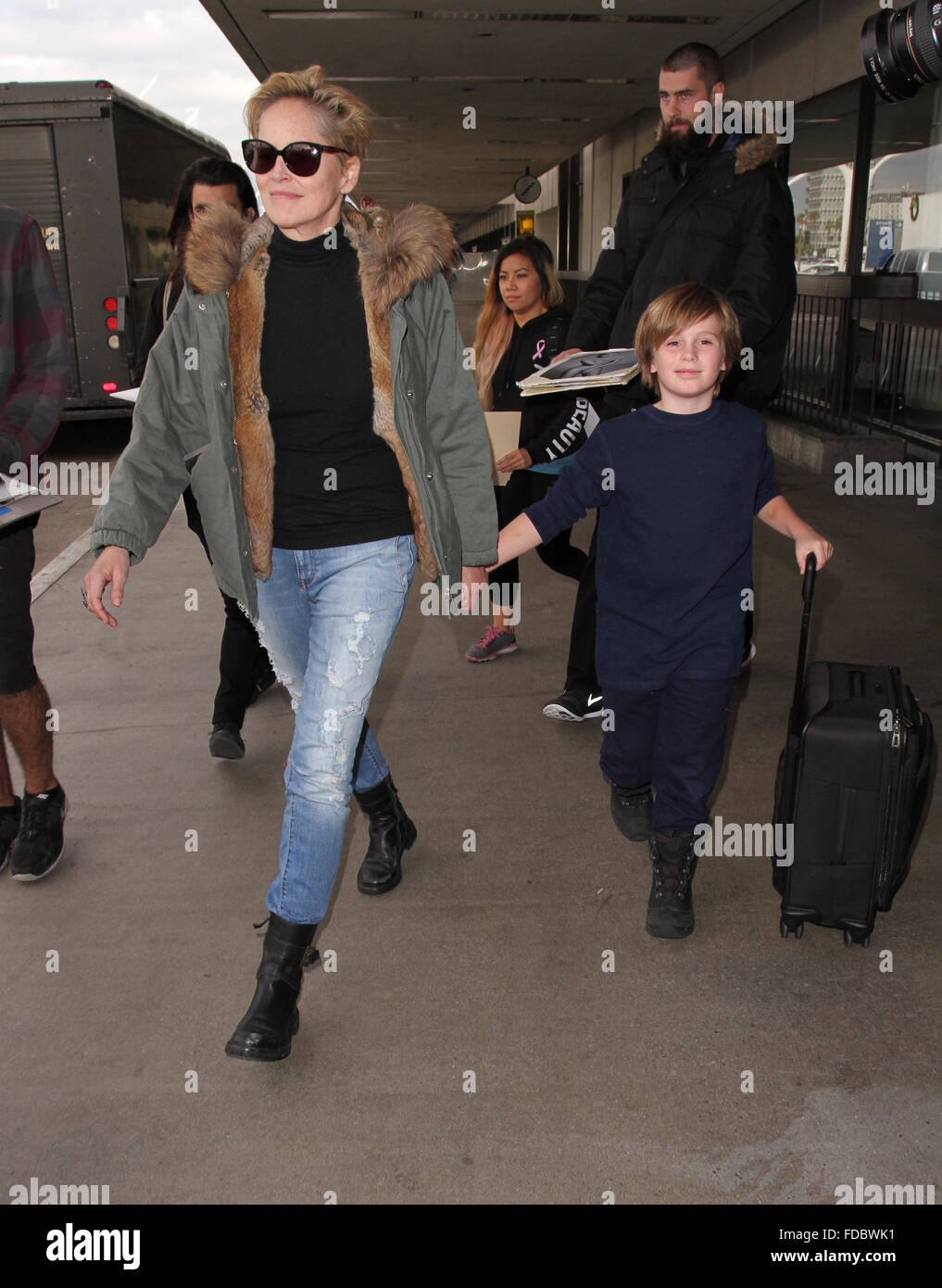 Sharon Stone and her son Quinn arrive at Los Angeles International