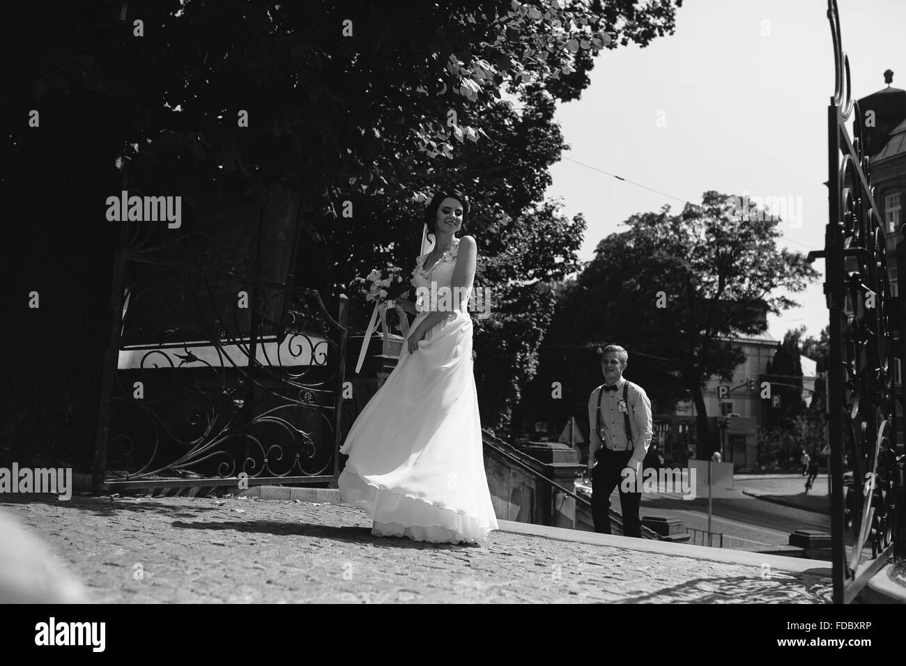 bride and groom posing on the streets of the old town Stock Photo - Alamy