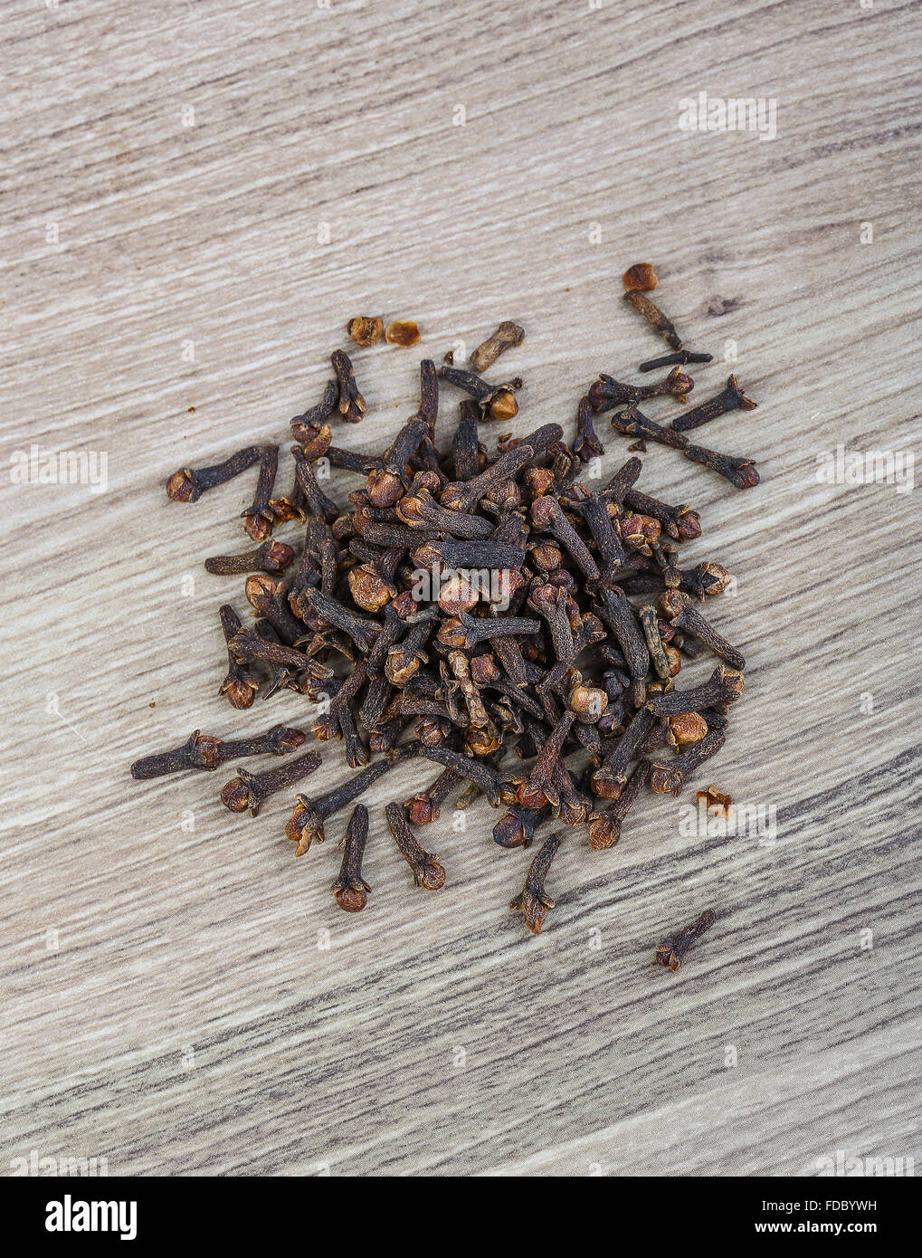 Aromatic Dried Cloves seeds on the wood background Stock Photo - Alamy