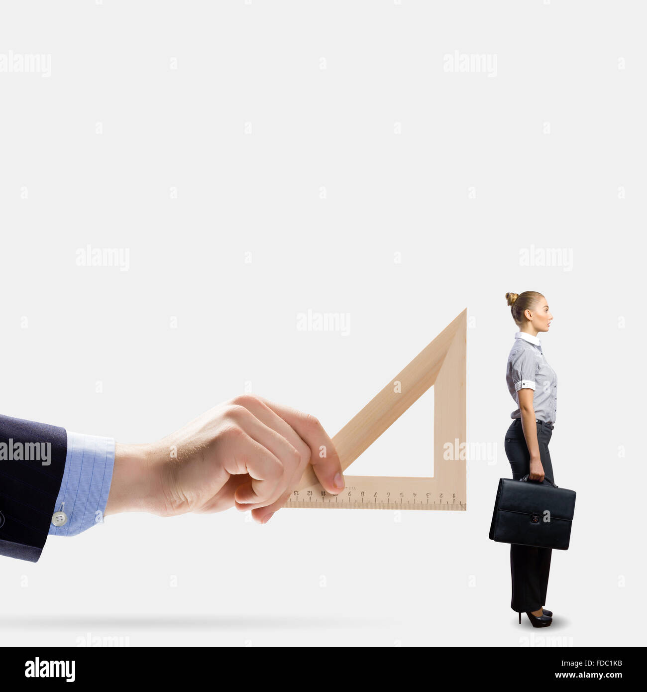 Lady With Ruler Businessman measuring miniature of business lady with ruler hi-res ...