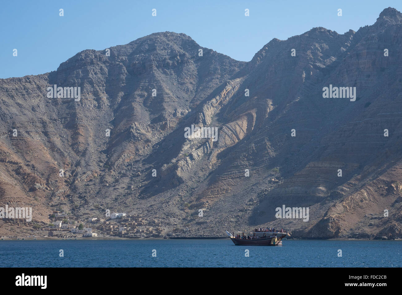 Oman, Musandam fjord, fishing village & dhow Stock Photo