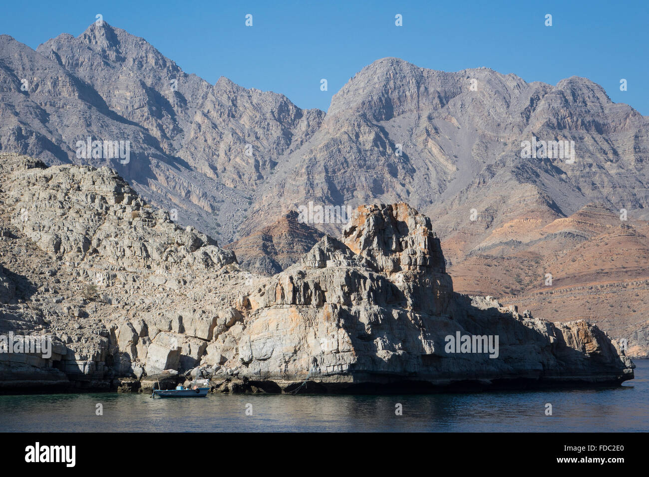 Oman, Musandam fjord & small fishing boat Stock Photo