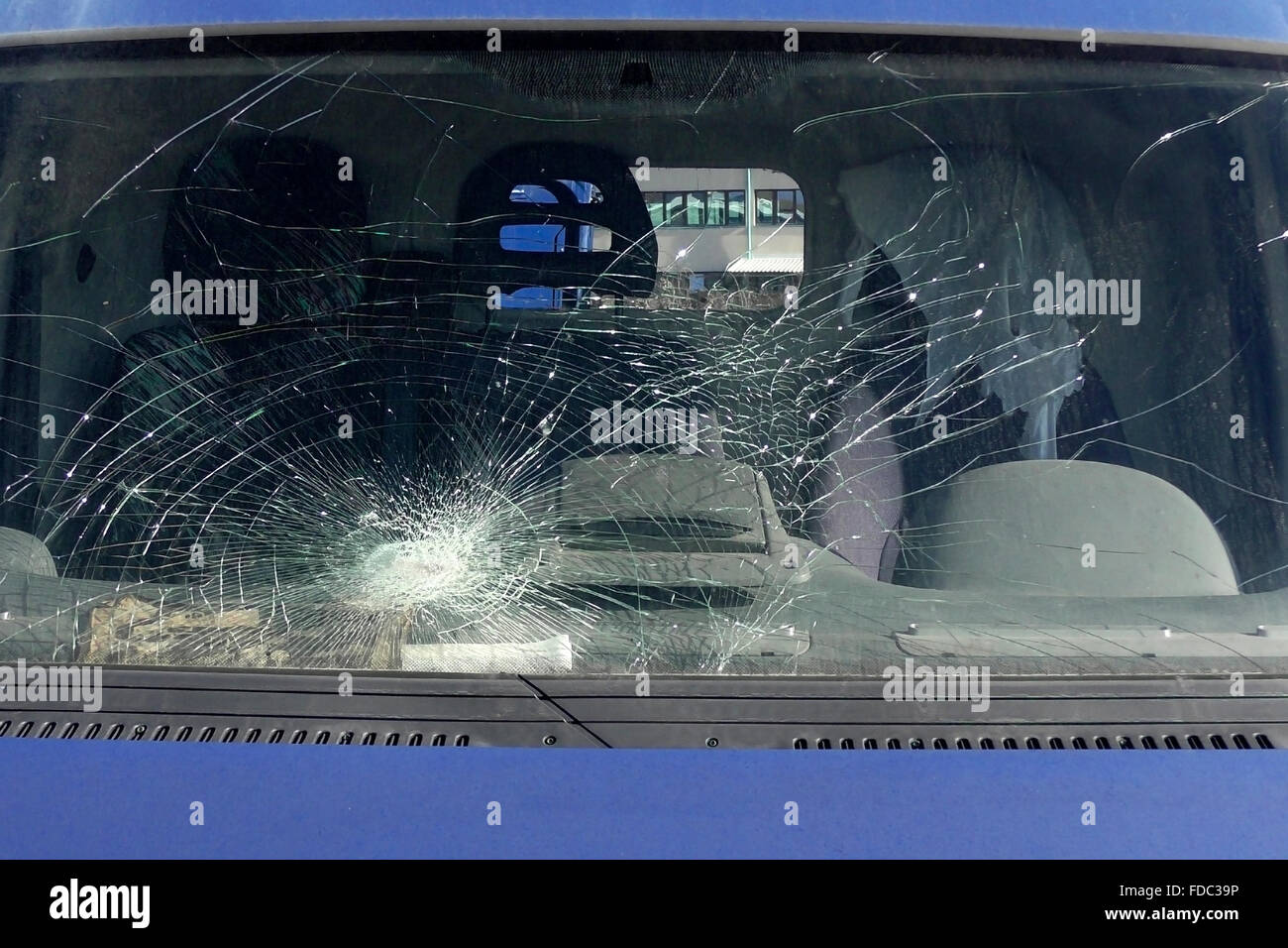 Broken windshield on the blue car Stock Photo