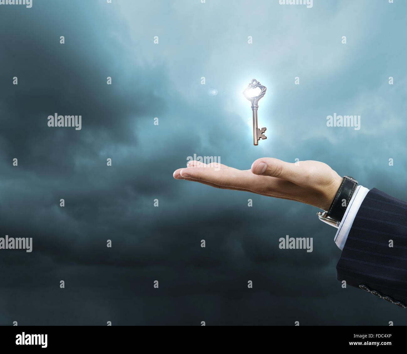 Close up of human hand holding key Stock Photo - Alamy