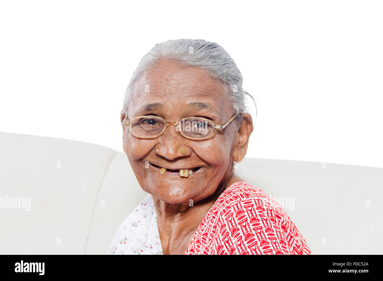 1 Senior Adult Woman Smiling Sitting Sofa Stock Photo