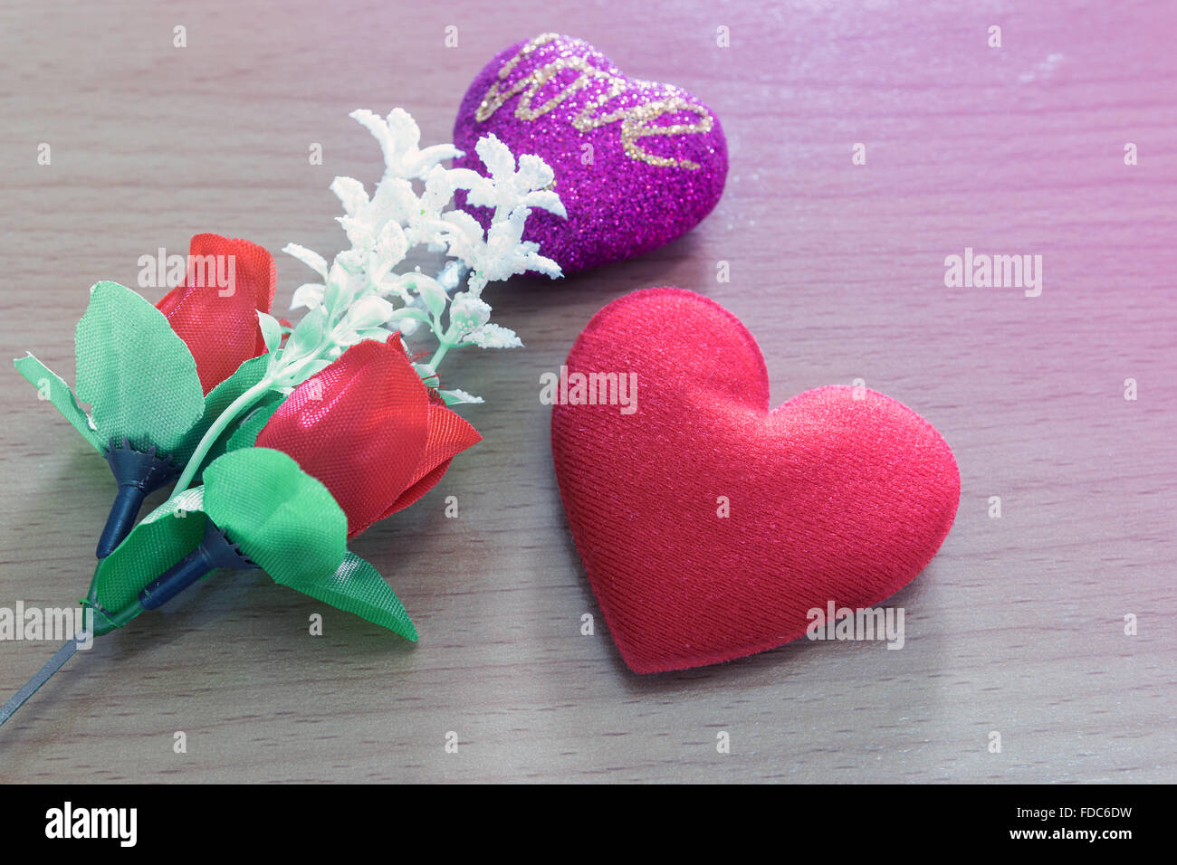 Red heart shaped and red roses on wooden background sign for love and ...