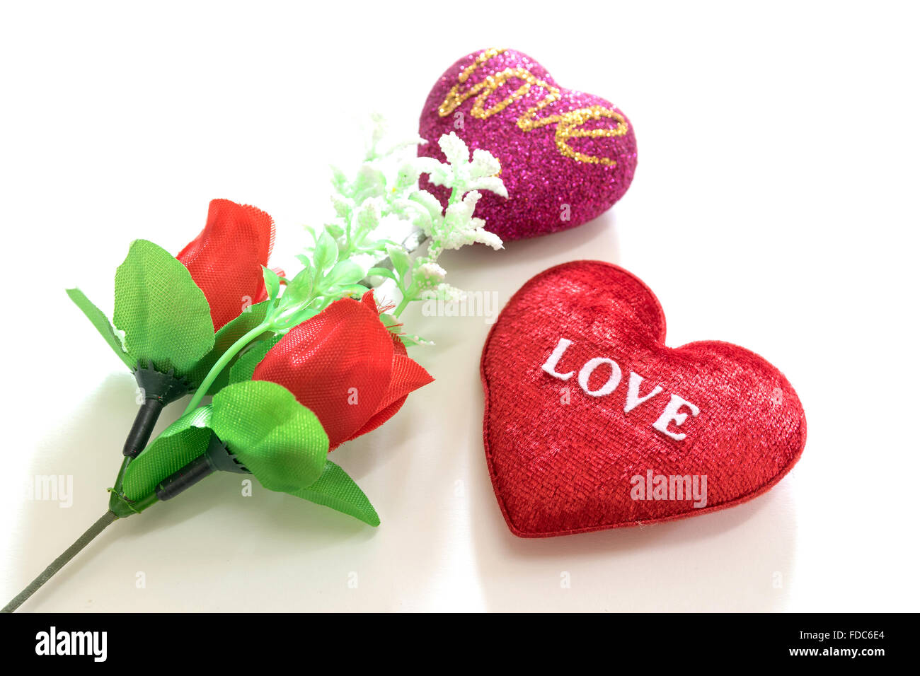 Red heart shaped and red roses on white background sign for love and ...