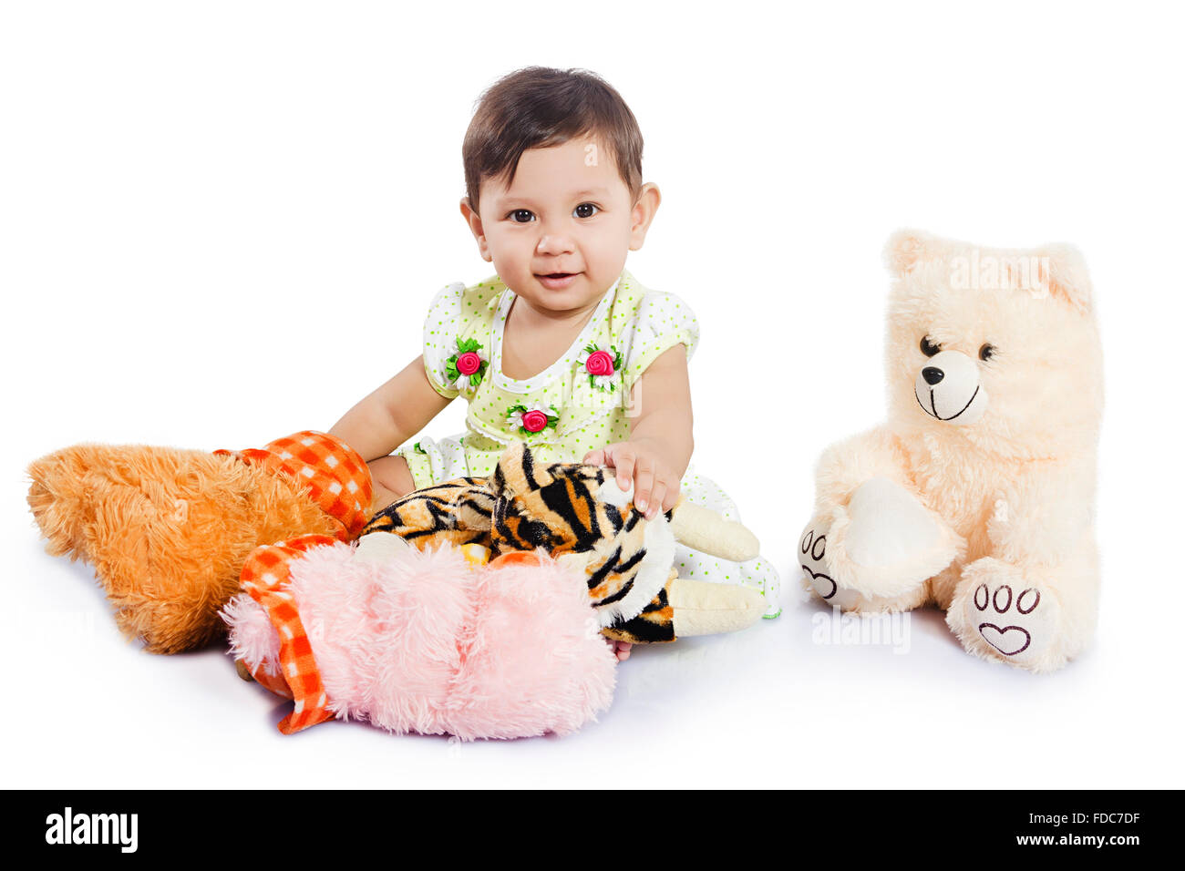 1 Child Baby Girl Sitting Playing Stuffed toys Stock Photo
