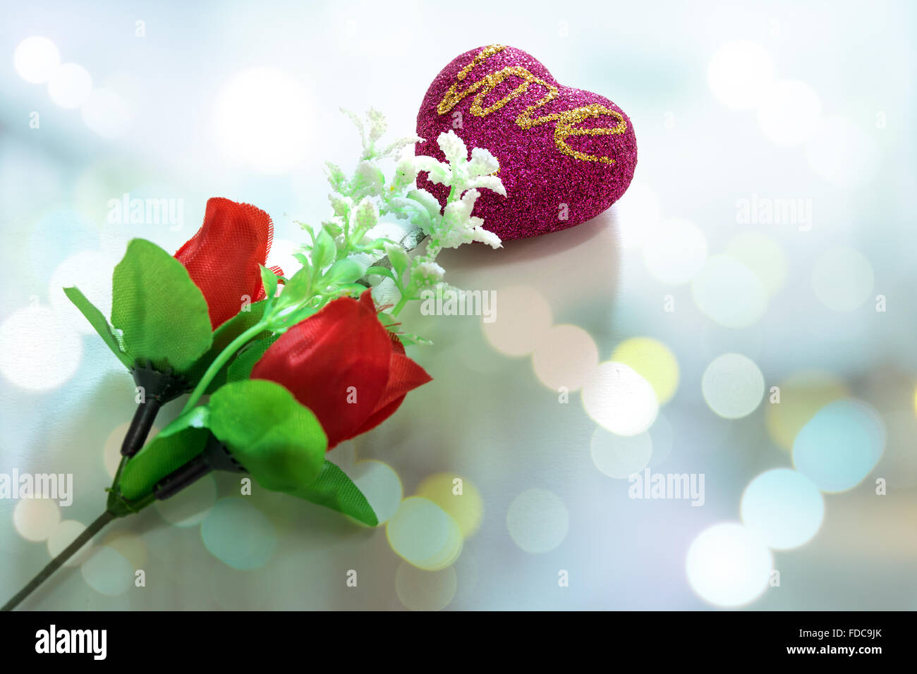 Heart shaped and red roses on white background sign for love and ...
