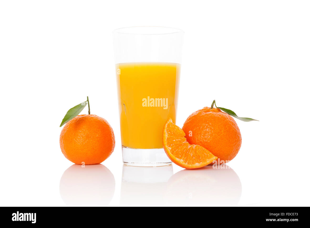 Fresh tangerine juice and ripe mandarin isolated on white background. Healthy fresh fruit juice