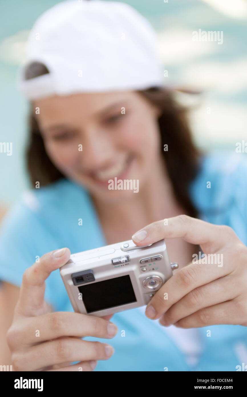 Young woman using digital camera Stock Photo - Alamy