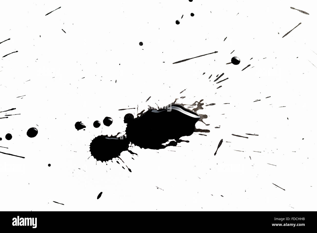 Abstract image with splashes of black paint on white background Stock Photo