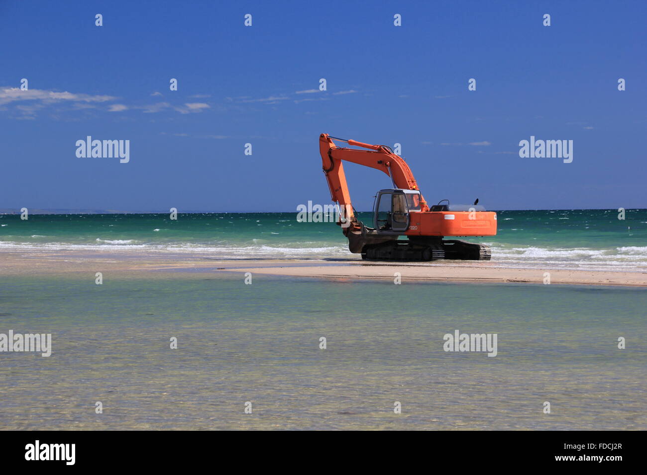excavator on the beach Stock Photo - Alamy