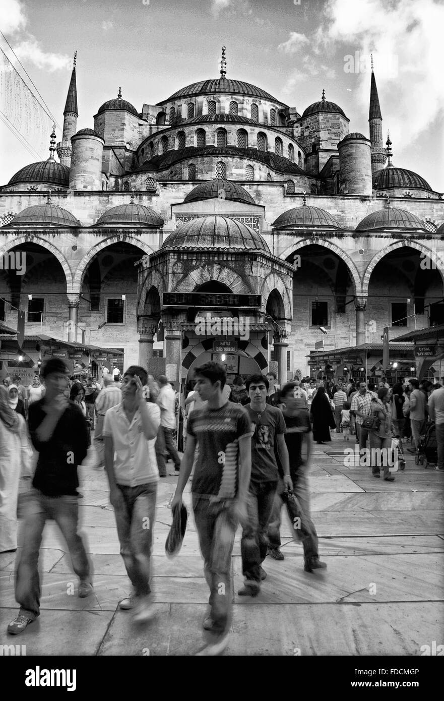 ISTANBUL - SEPT 6: Unidentified going out after praying at Yeni Cami Mosque, Istanbul, Turkey on Sept 6, 2009. Low motion pic Stock Photo