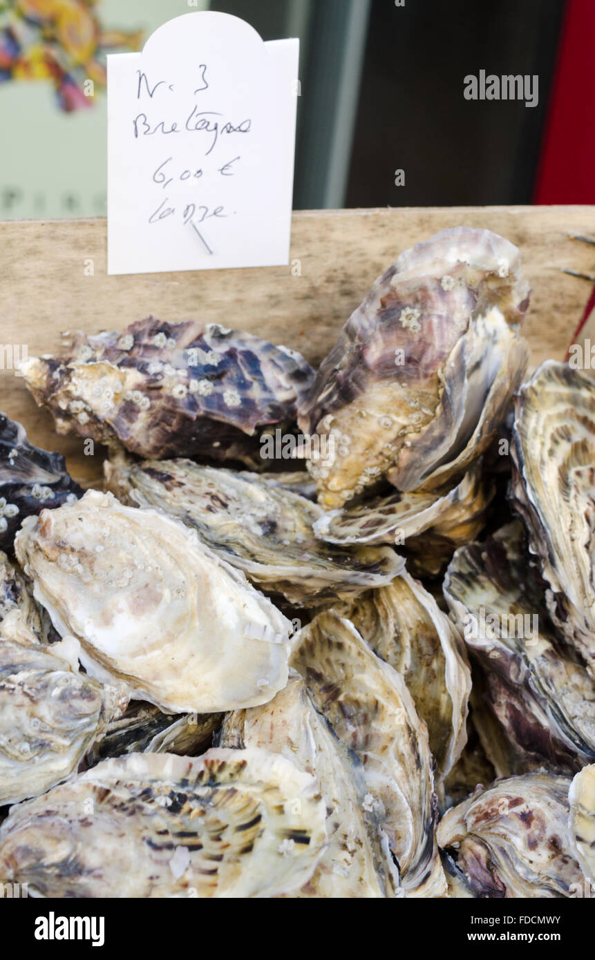 Number 3 Bretagne huitres/oysters in a wooden box on a French market stall Stock Photo