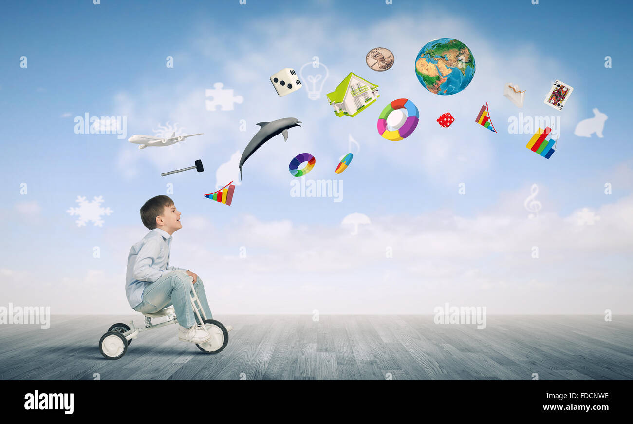 Little joyful cute boy riding tricycle. Elements of this image are ...