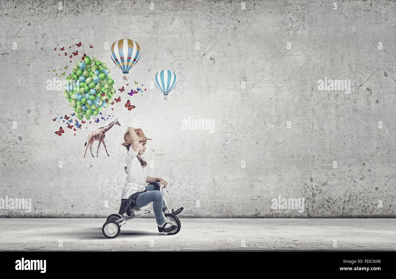 Little cute girl of preschool age riding tricycle Stock Photo Alamy