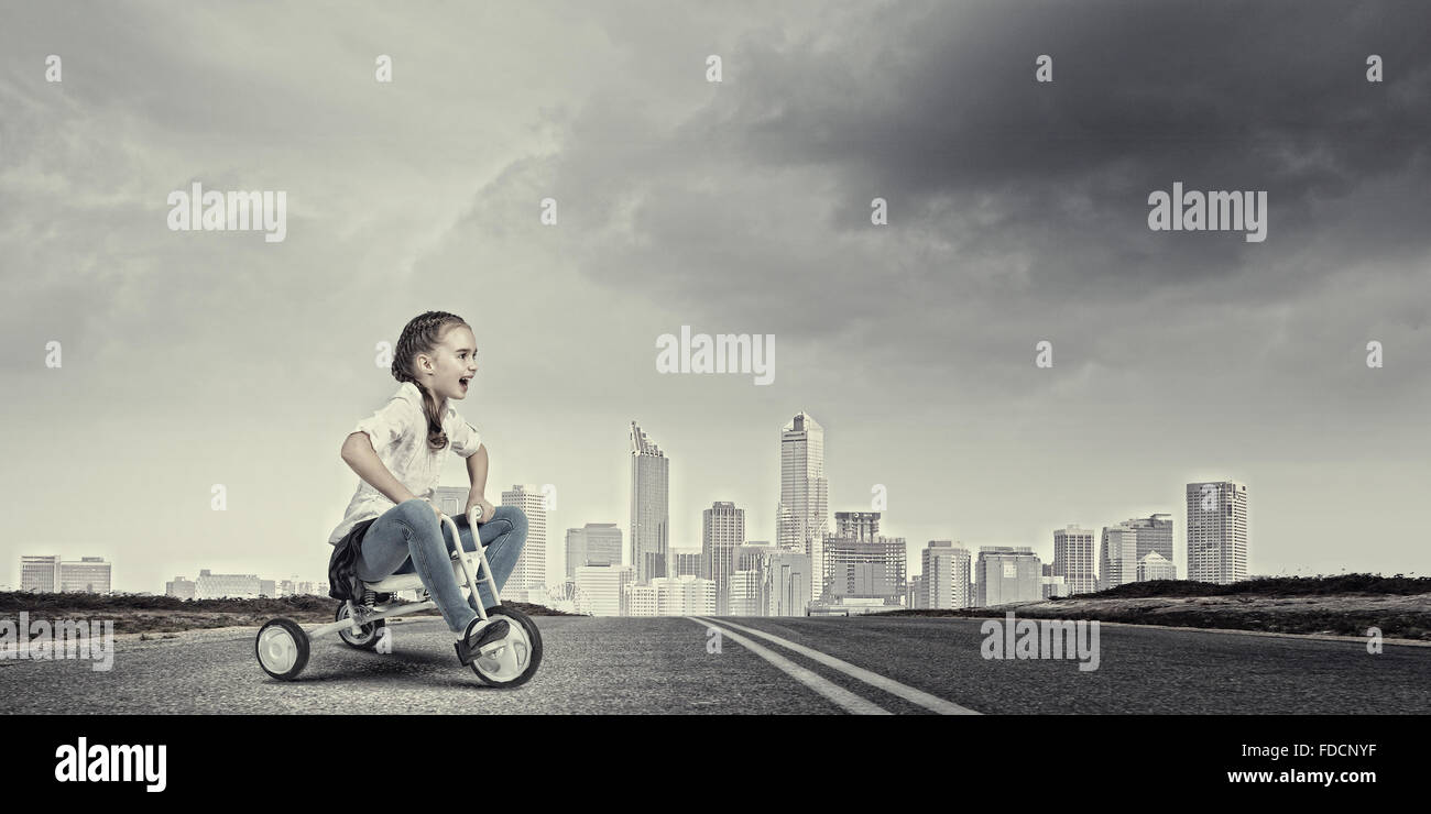 Little cute girl of preschool age riding tricycle Stock Photo Alamy