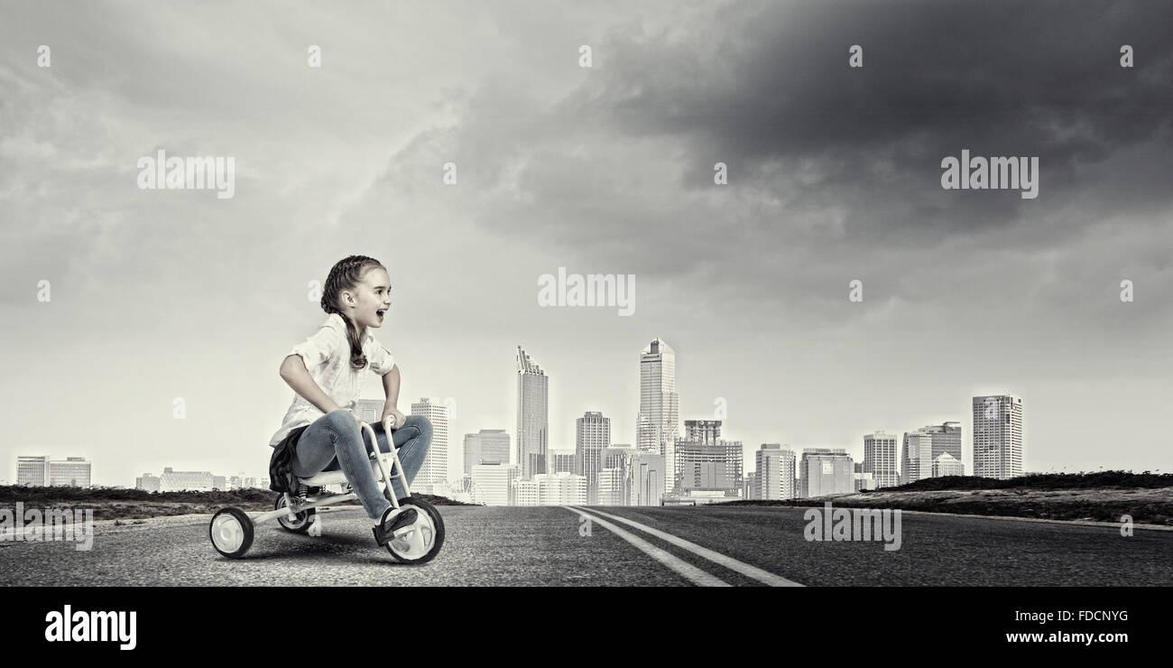 Little cute girl of preschool age riding tricycle Stock Photo Alamy