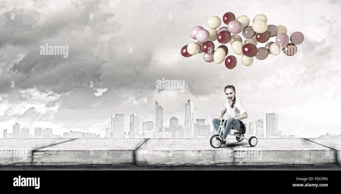 Little cute girl of preschool age riding tricycle Stock Photo Alamy