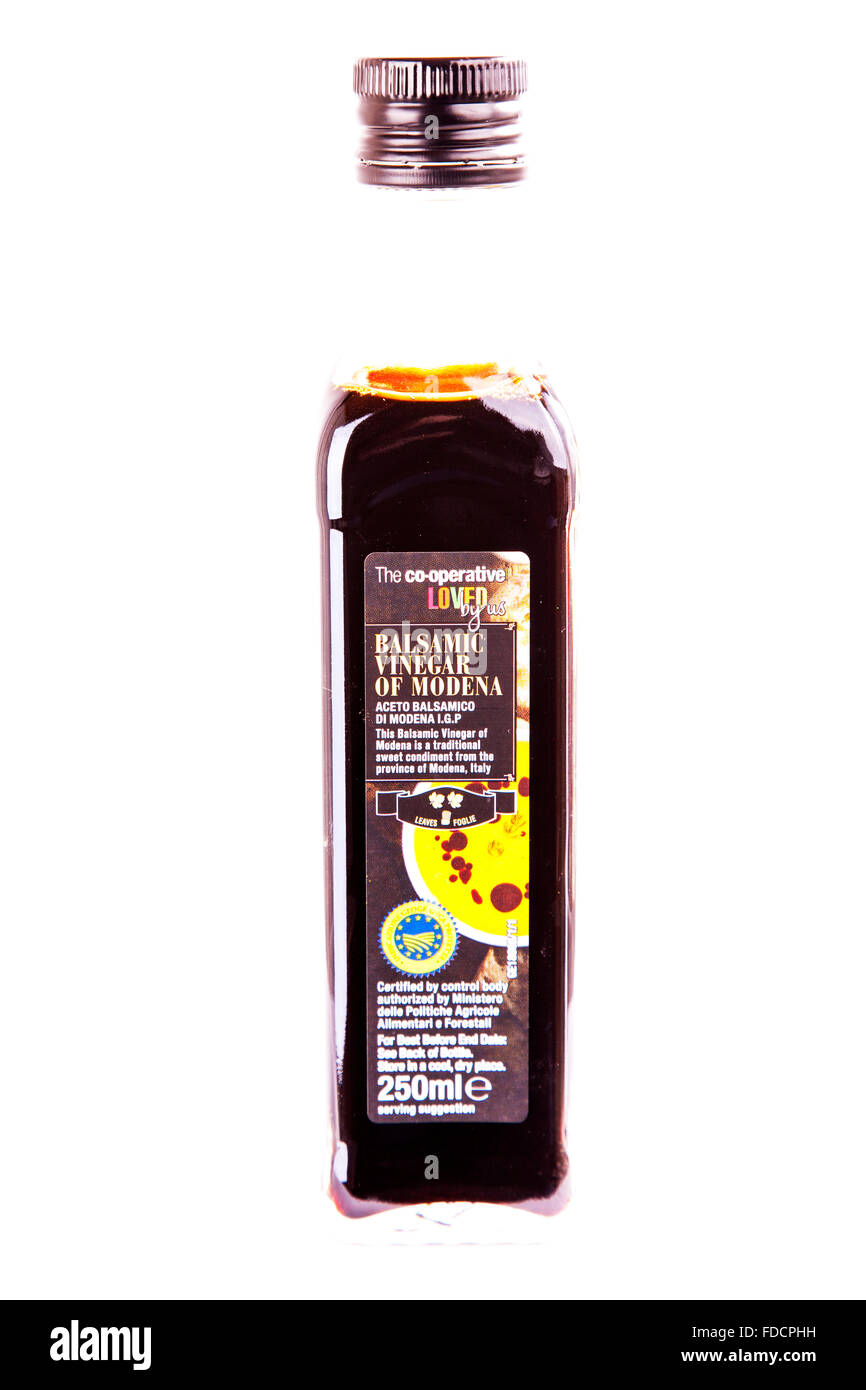 Balsamic vinegar of Modena bottle co op make sweet condiment cut out cutout white background isolated Stock Photo