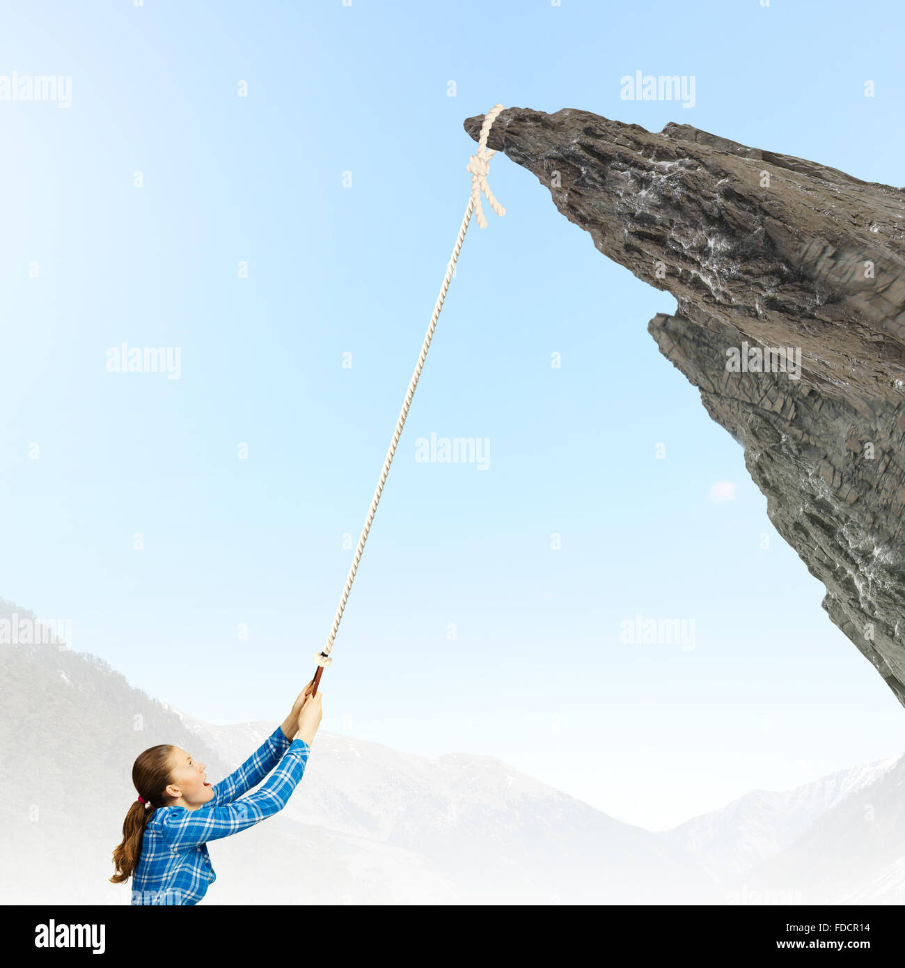 Climbing Help With Rope Young woman climbing rock with help of rope Stock Photo - Alamy