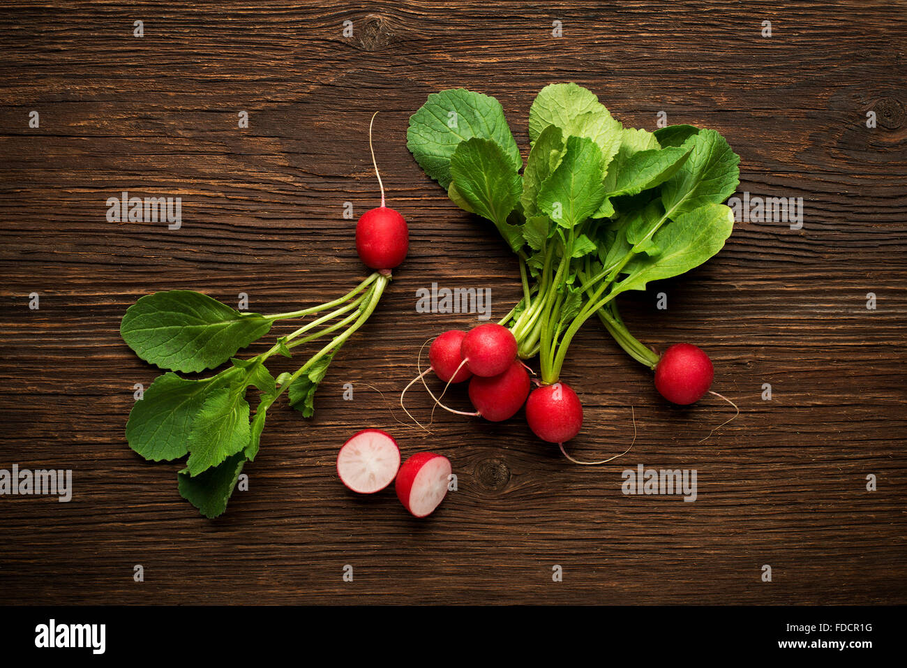 Fresh red radish on wooden background close up Stock Photo
