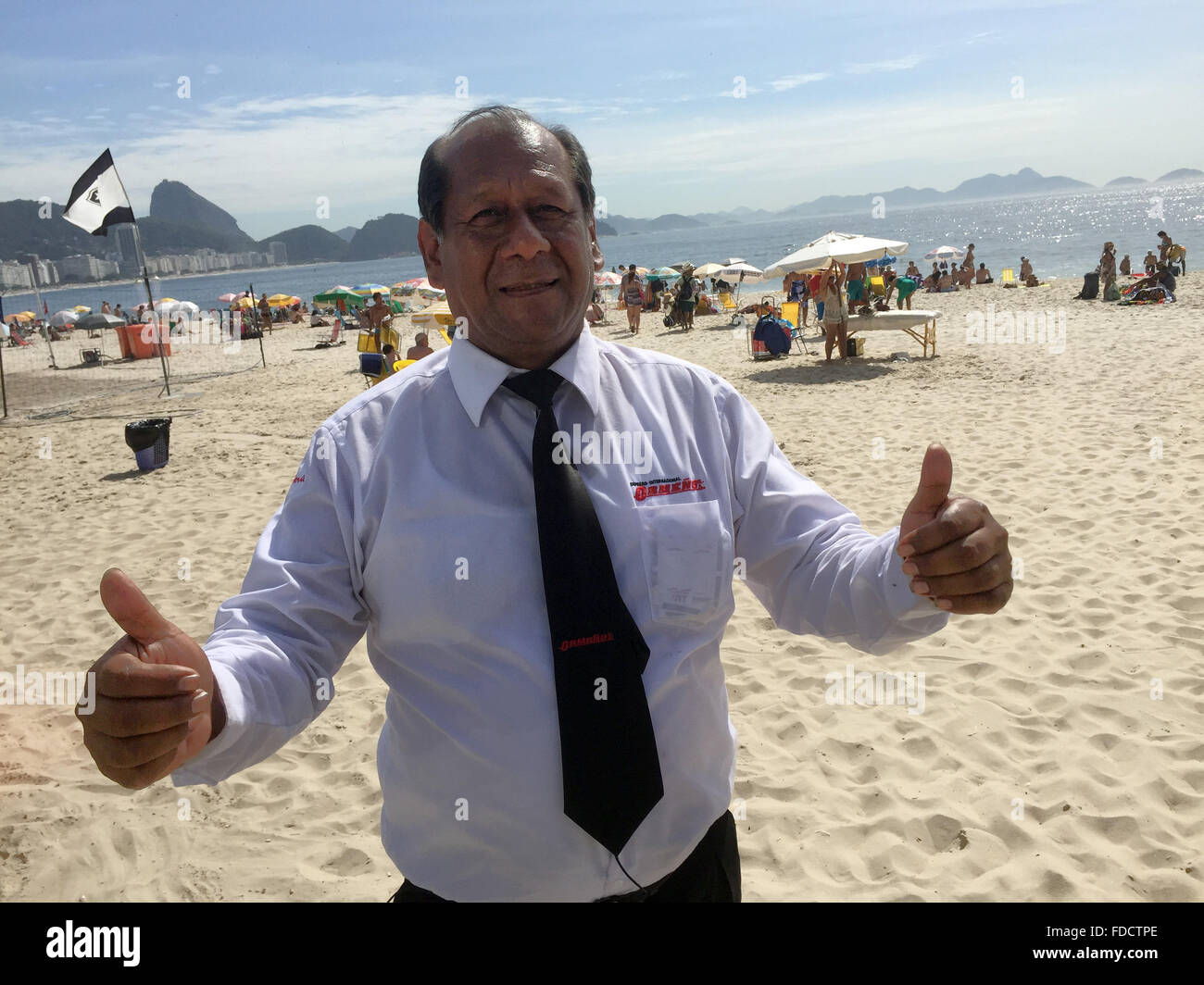 Rio de Janeiro, Brazil. 30th Jan, 2016. Head bus driver of the bus company Ormeno, Daniel Mancilla Palacios stands on the beach in Rio de Janeiro, Brazil, 30 January 2016. At 6200 kilometers long and 102 hours of driving time, the bus route from the Altantic to Lima is considered to be the longest bus route in the the world. Photo: Georg Ismar/dpa/Alamy Live News Stock Photo