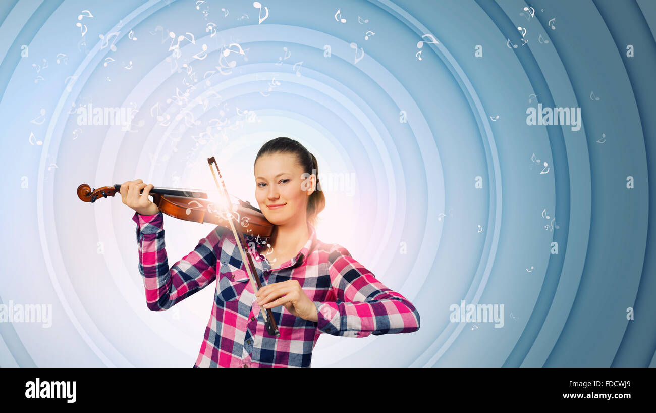 Young pretty girl in casual playing violin Stock Photo - Alamy