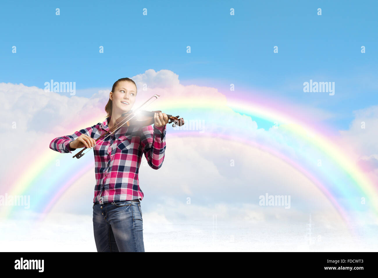 Young pretty girl in casual playing violin Stock Photo - Alamy