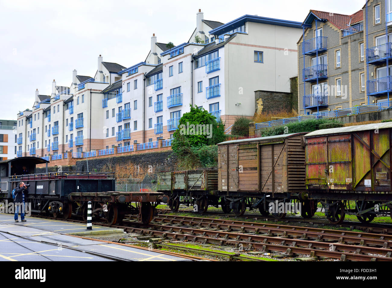 Spike Island historic railway tracks with modern flats behind on Cumberland Rd overlooking Bristol floating harbour Stock Photo