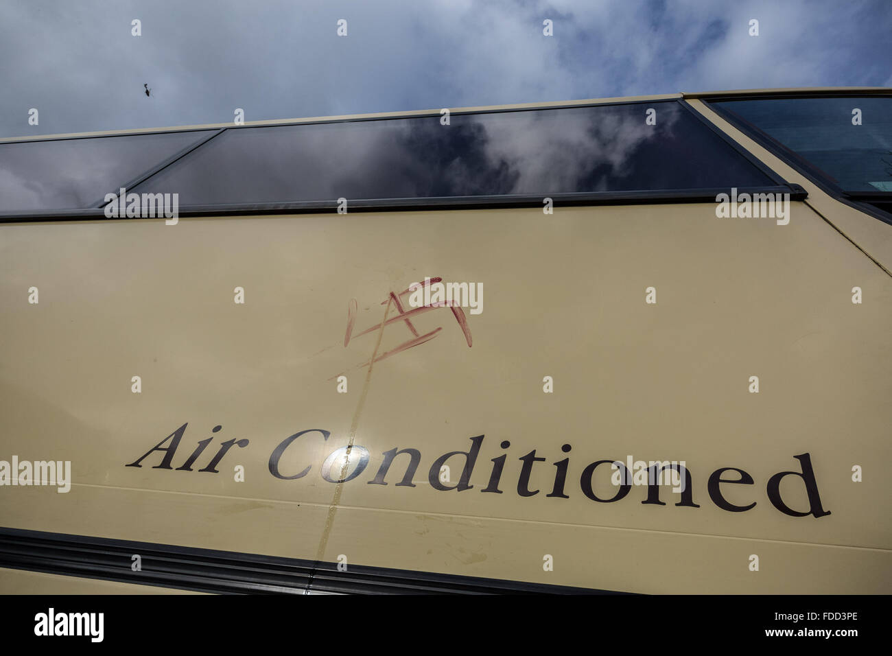 Kent, UK. 30th January, 2016. A swastika daubed in blood by a far-right protester on a coach carrying London anti-fascist counter-protesters at Maidstone services station Credit:  Guy Corbishley/Alamy Live News Stock Photo