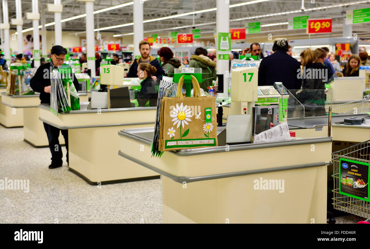 Inside supermarket with checkout tills and lifetime shopping bags Stock Photo