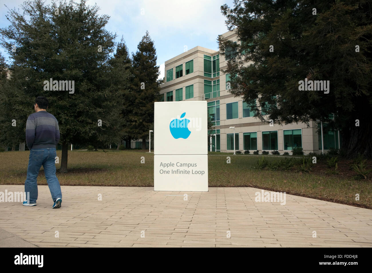 People are seen at Apple's corporate headquarters in Cupertino