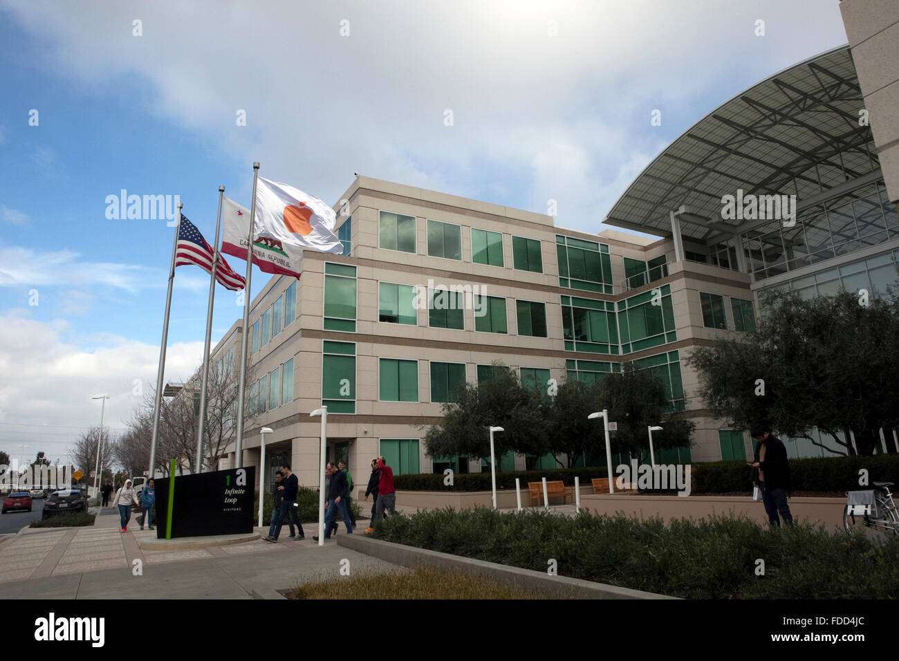 People are seen at Apple's corporate headquarters in Cupertino