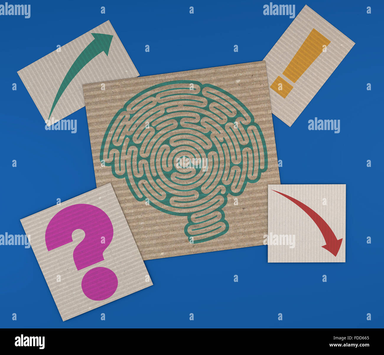 Brain-shaped maze on a sheet of paper, corrugated cardboard with ...