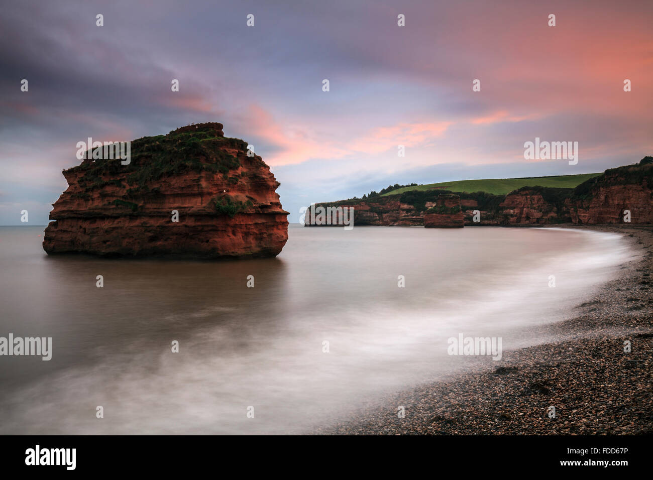 A sea stack at Ladram Bay near Sidmouth in South East Devon captured at sunset. Stock Photo