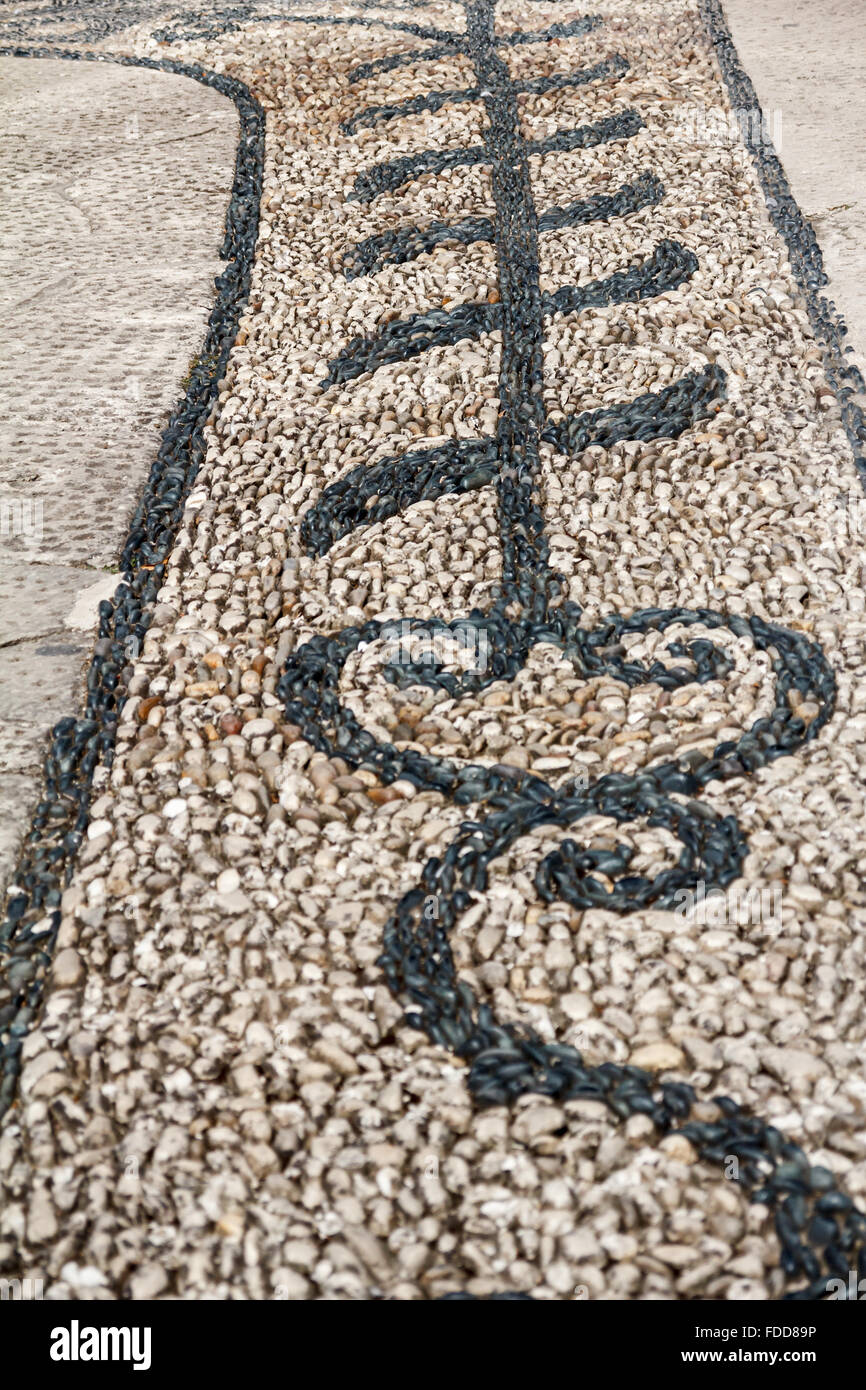 Flower ornament made of black and white pebbles on the path in Harem, Topkapi Palace, Istanbul, Turkey Stock Photo