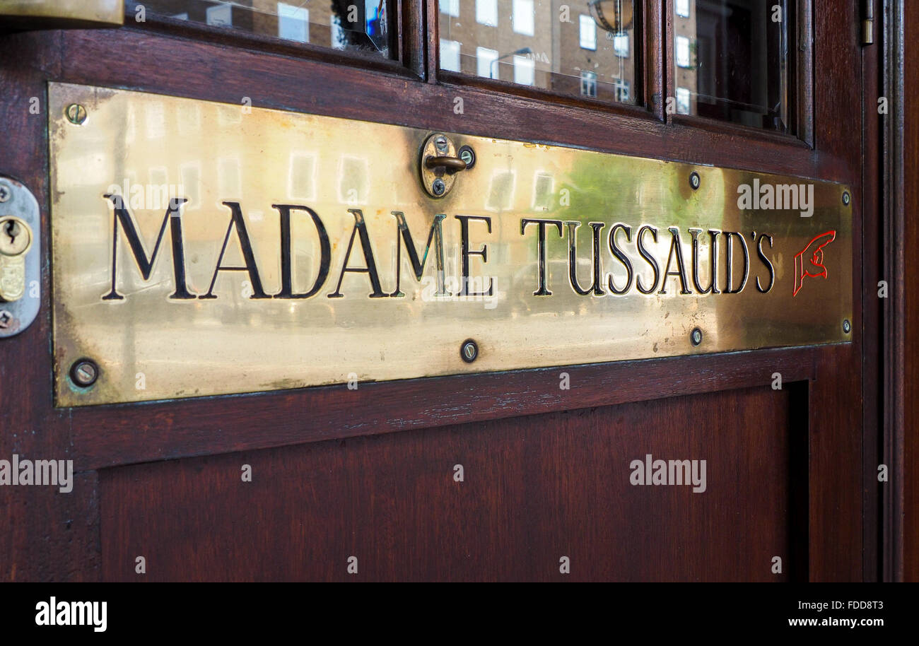 Detail of entrance of Madame Tussaud's museum with brass ensign and wooden door. Stock Photo