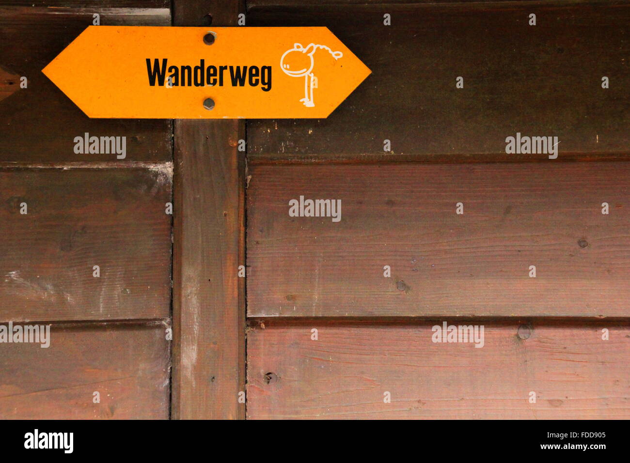 wanderweg (german) written on a yellow direction sign Stock Photo