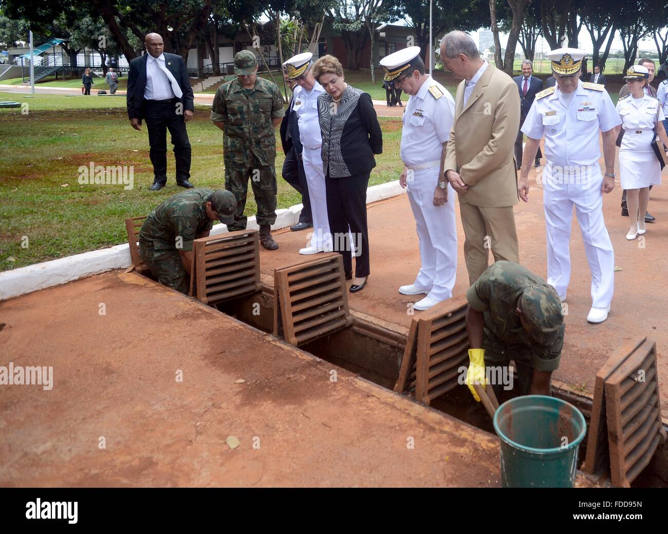 Brazil President Dilma Rousseff watches as sailors clean out storm drains at the Naval Headquarters to prevent breeding of aedes aegypti mosquitos during control efforts to halt the outbreak of Zika virus January 29, 2016 in Brasilia, Brazil. Stock Photo