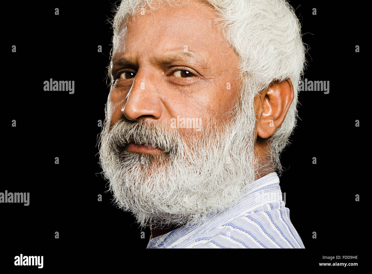 1 indian Senior Adult Man  Extreme face Seniors side pose  Looking-At-Camera Stock Photo