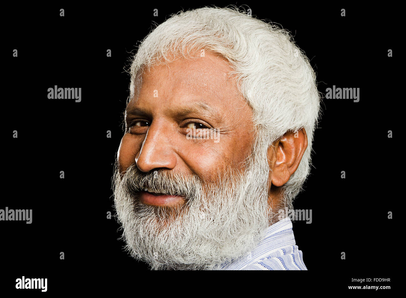1 indian Senior Adult Man Extreme face side pose  smiling Looking-At-Camera Stock Photo