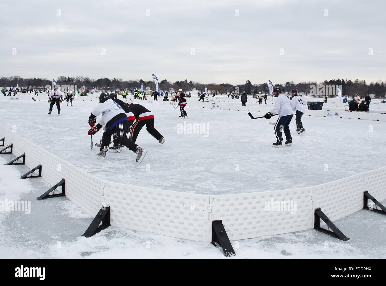 Competitors playing hockey at the U.S. Pond Hockey Championships in