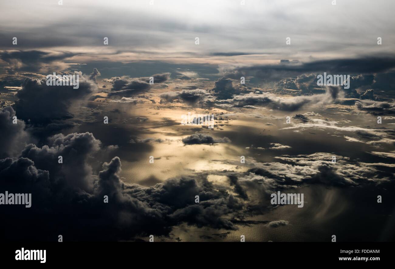Clouds above the sea with the sun reflecting of the water Stock Photo ...