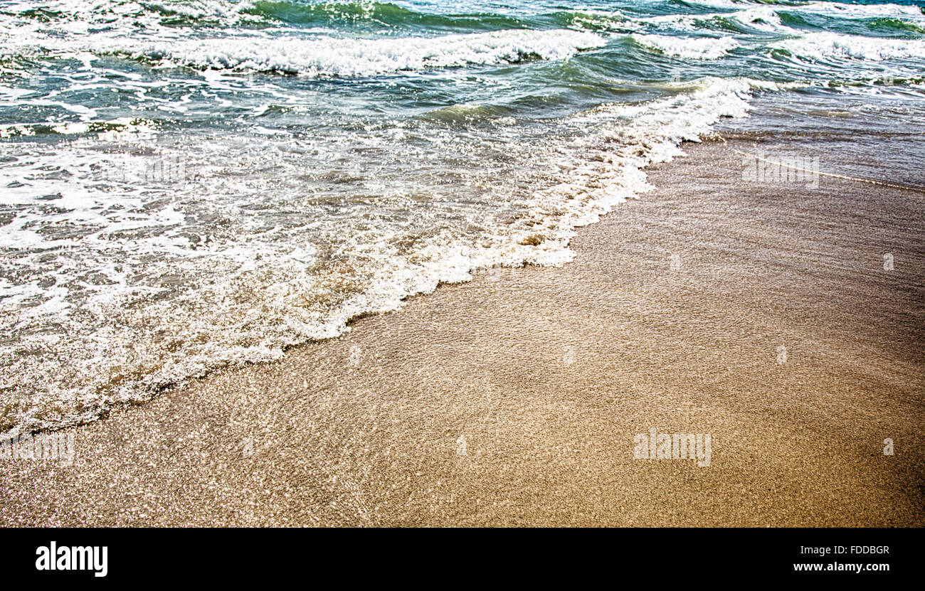 A wave crashes ashore near Kure Beach, North Carolina Stock Photo Alamy
